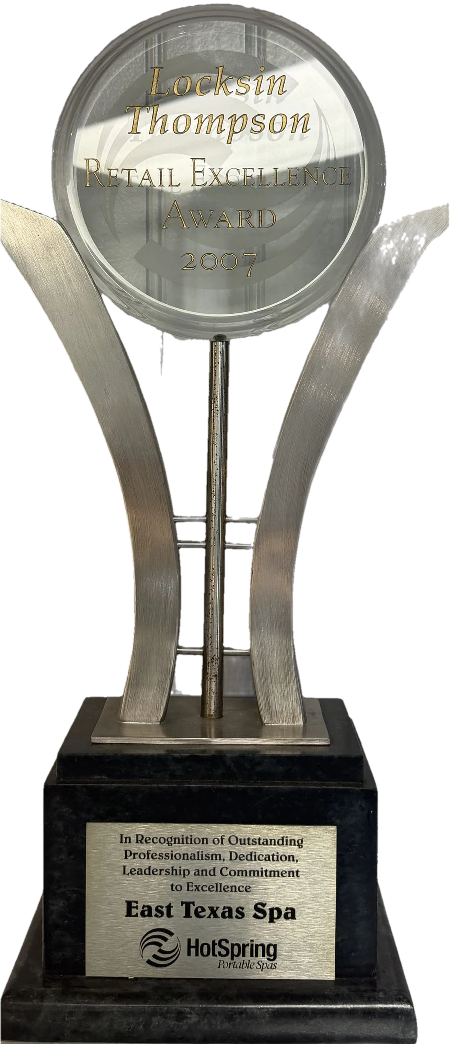 The Locksin Thompson Retail Excellence Award trophy Hot Spring presented to East Texas Spa in 2007